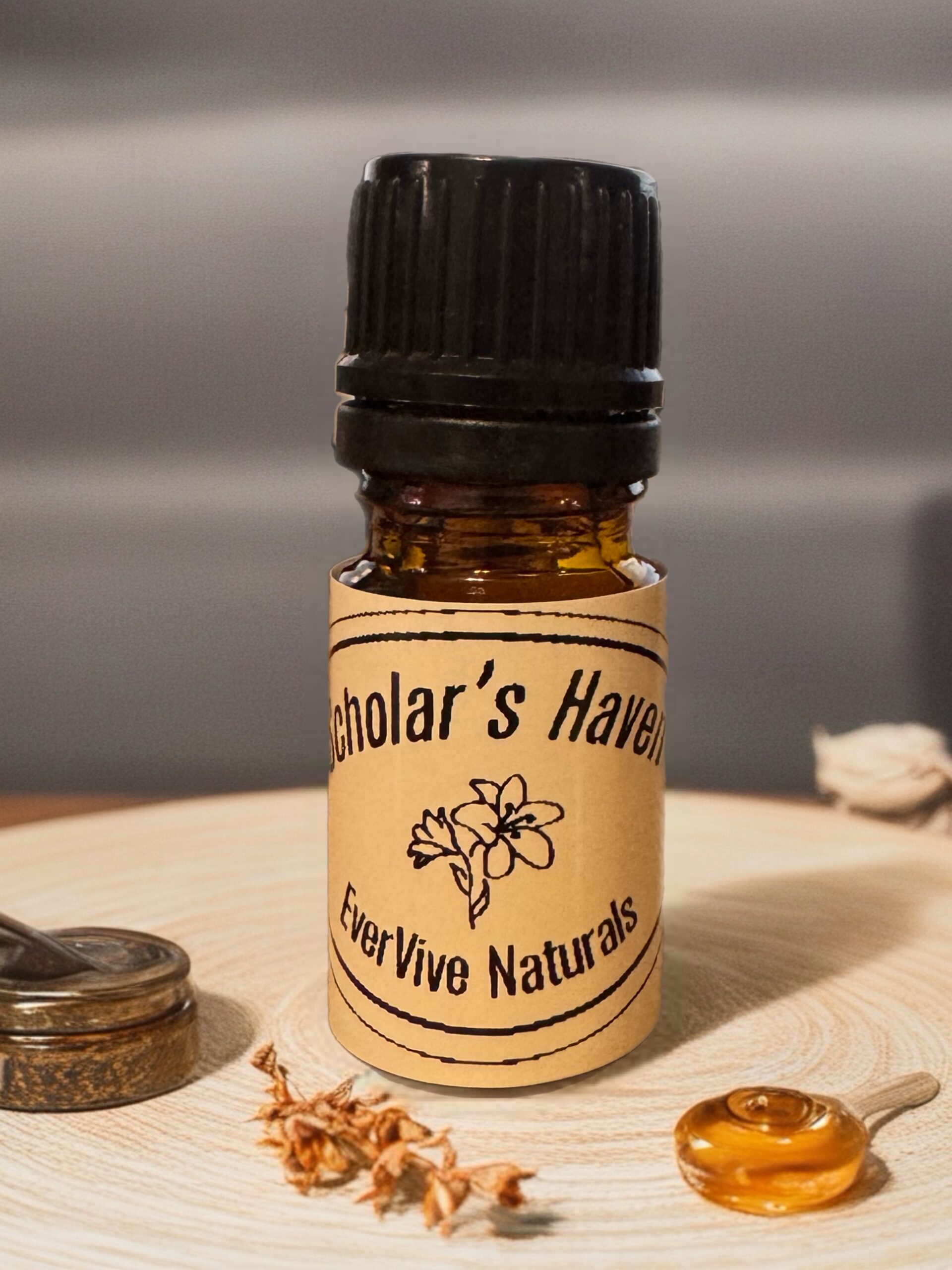 Scholar’s Haven Blend – calming essential oil blend with peppermint, blood orange, and fir needle in amber bottle on desk with journal