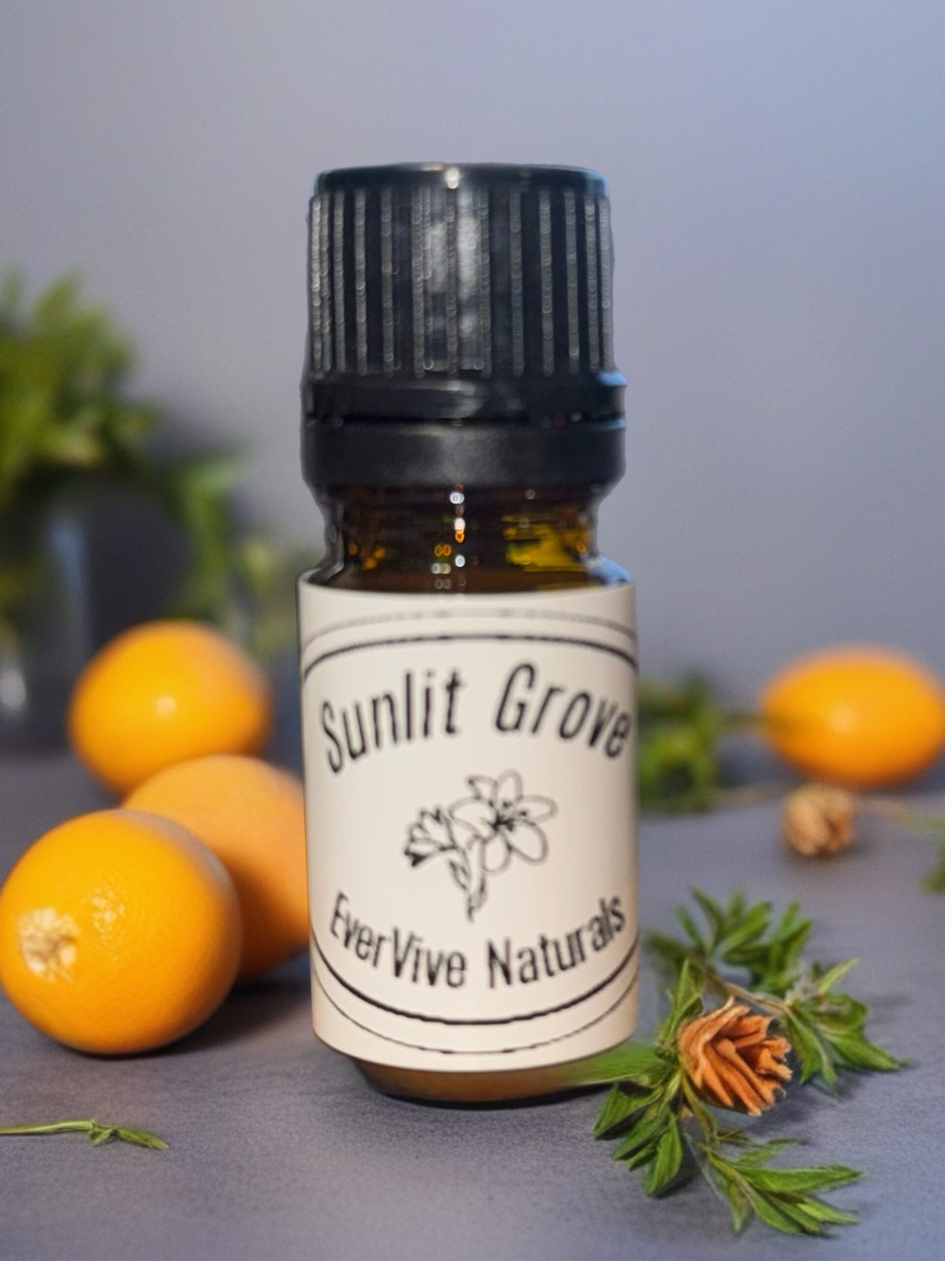 Sunlit Grove Blend – citrus and herb essential oil blend with lemon, thyme, and rosemary in amber bottle on sunny windowsill